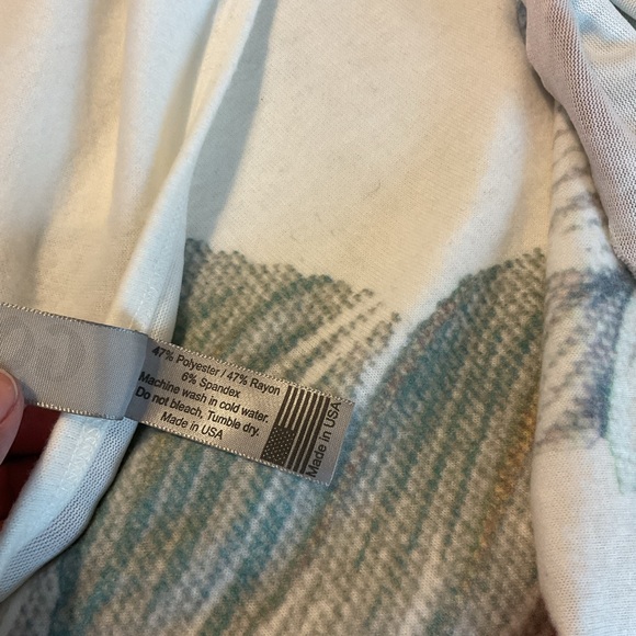 An asymmetrical hem lends a chic vibe to this soft and cozy pullover. - Picture 6 of 6